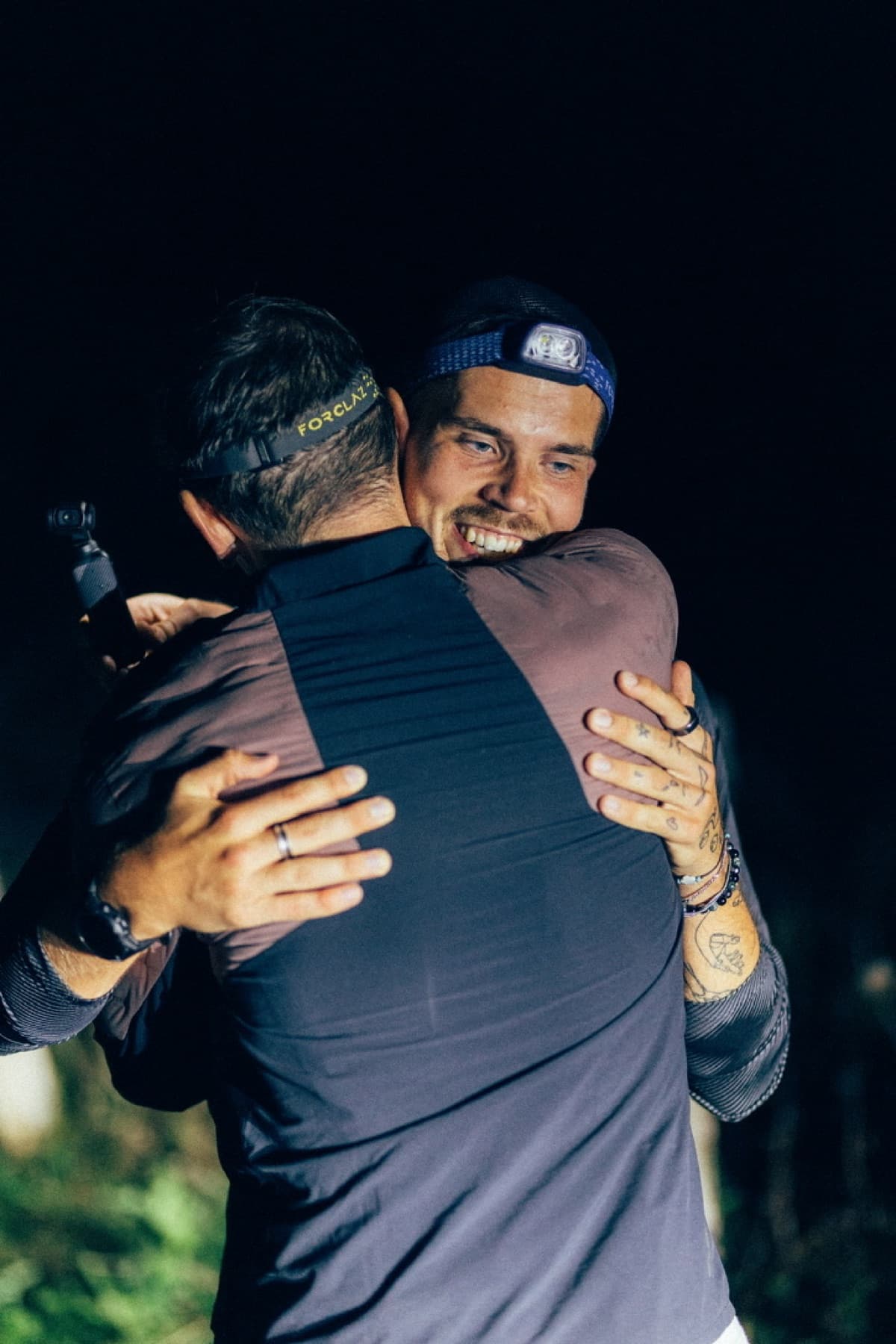 Jonathan embracing a friend, a raw moment of relief and connection.